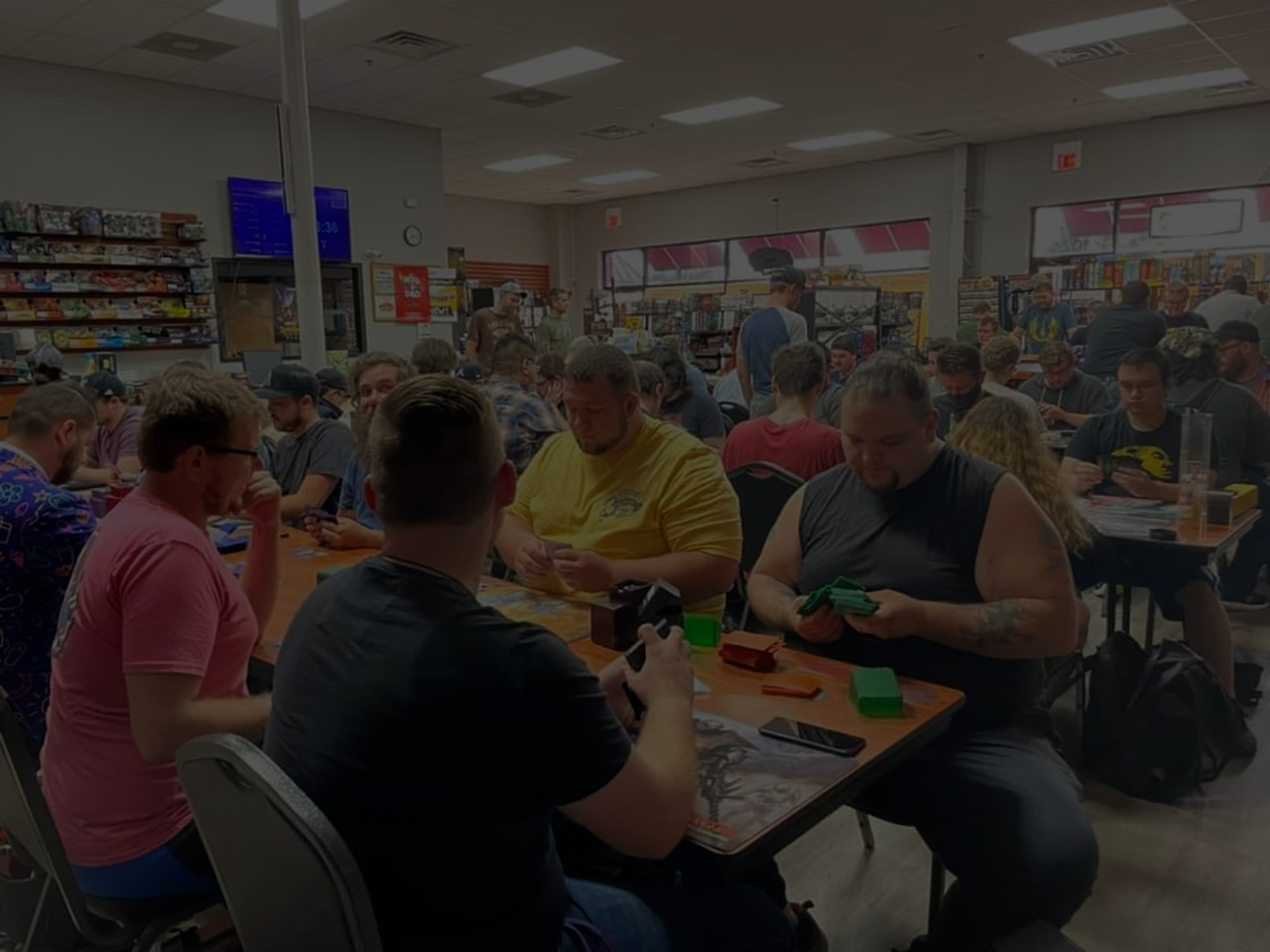 Players gathered around tables for a game at GameStorm Gaming